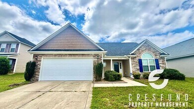 Building Photo - Freshly Painted and Spacious 4 Bedroom, 3 ...