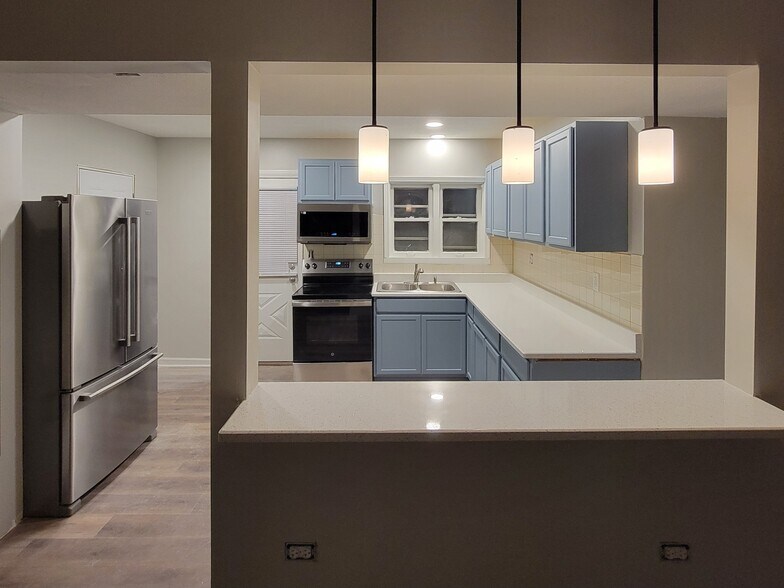 View of kitchen from bar - 465 W Main St