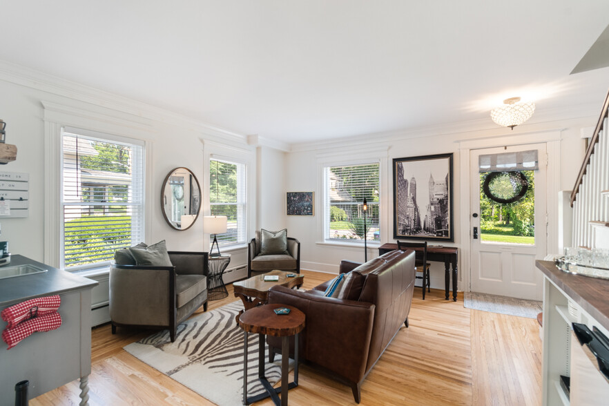 Living room complete with a wet bar, TV, mini fridge, bar sink - 5 W Jefferson Rd