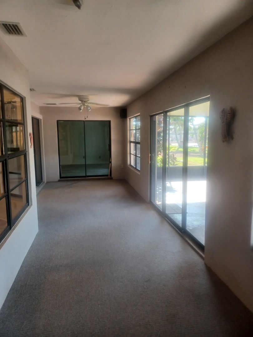 Building Photo - COMING SOON: Spacious Gulf Access 3 BR / 3 BA Home With a Large Screened Lanai for Entertaining &...