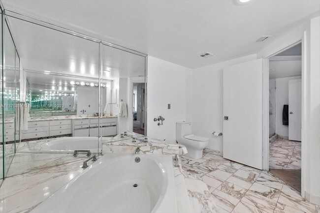 Building Photo - 10155 Collins Ave
