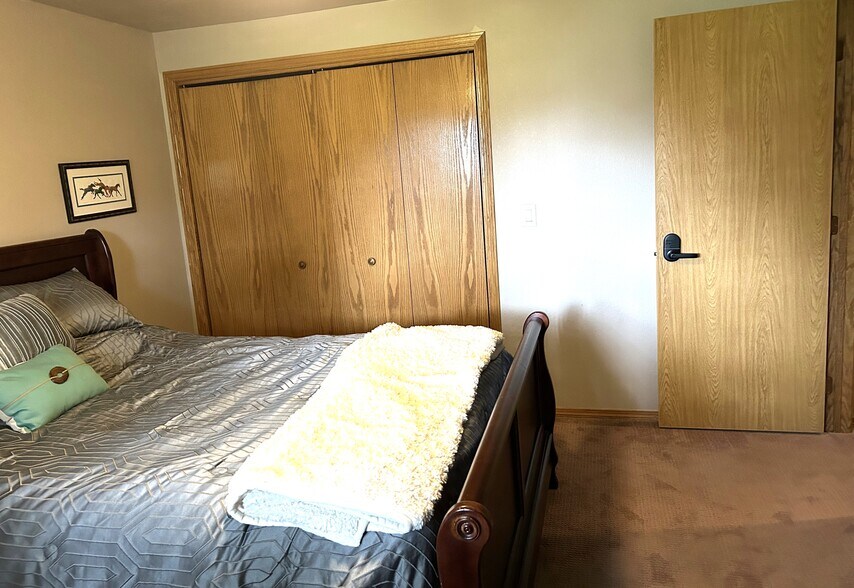 Bedroom with digital door lock - 205 S West Ave