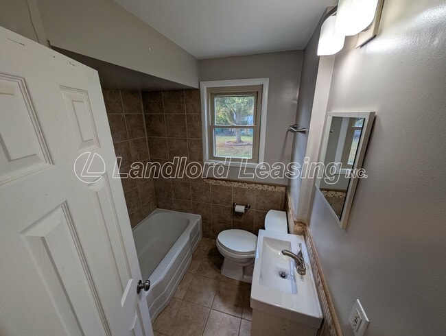Building Photo - Charming Brick Home with Fenced Yard and S...