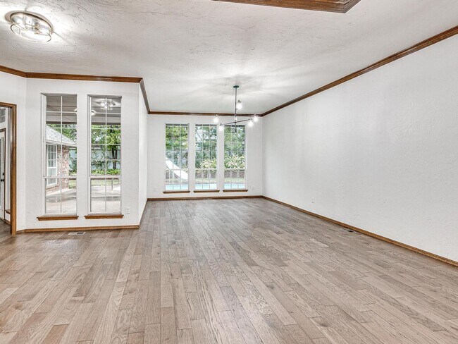Building Photo - 4 Bedrooms - 3 Bathrooms - 3 Car Garage - ...