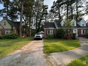 Building Photo - Charming Brick Cape Cope