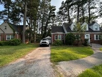 Building Photo - Charming Brick Cape Cope