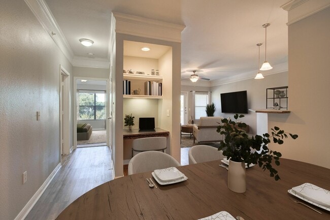 Open Floor Plan Living Area with Built-In Desk - Carrington at Champion Forest Apartments