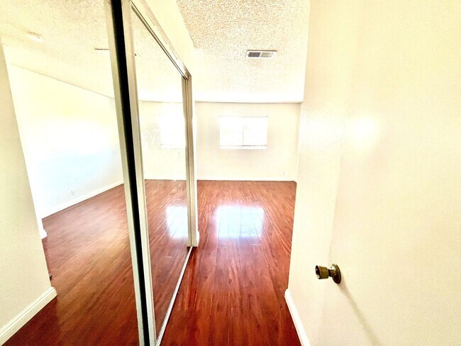 Building Photo - 2-Bedroom, 2-Bath Upstairs Condo Unit in Gated Pomona Community, Water/Trash/HOA Included!