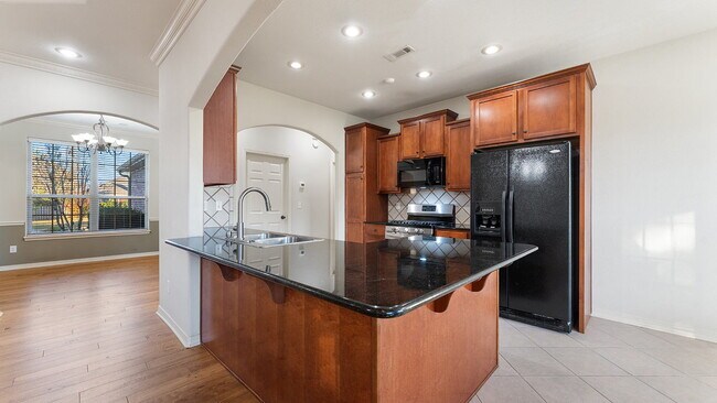 Building Photo - Charming 4-Bedroom Fayetteville Retreat with Granite Accents & Warm Fireplace!