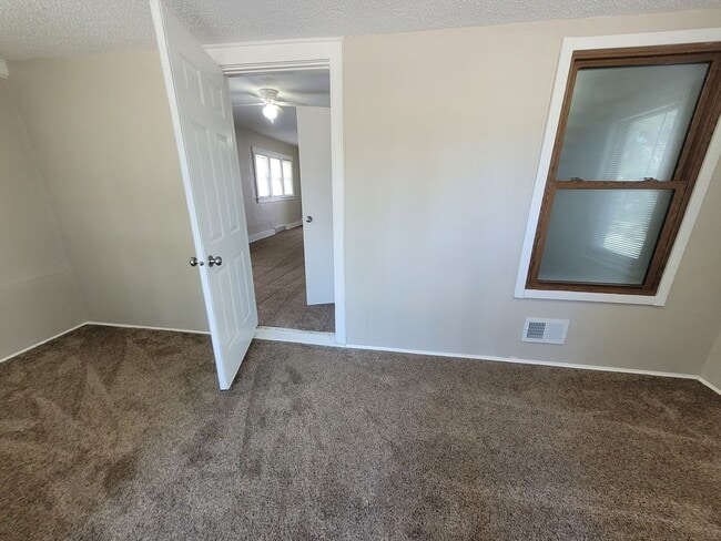 Building Photo - Four bedroom home on Indianola Ave with large yard and two decks!