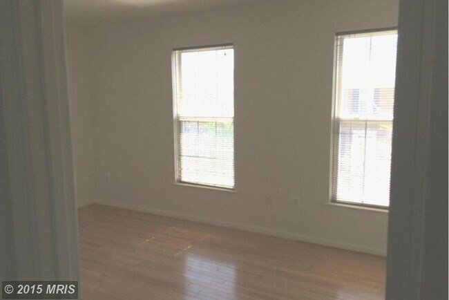 Building Photo - A spacious three bedroom, two and one half...