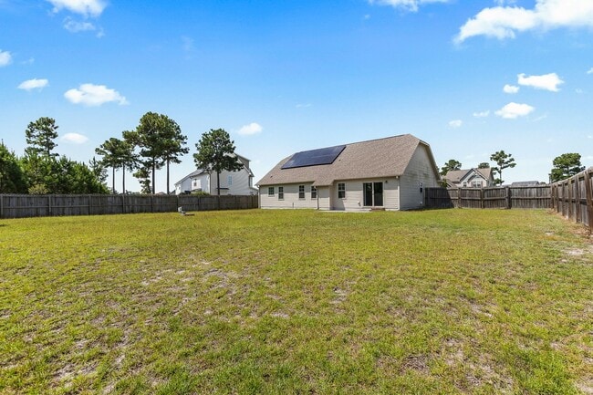 Building Photo - Spacious Home with Natural Light