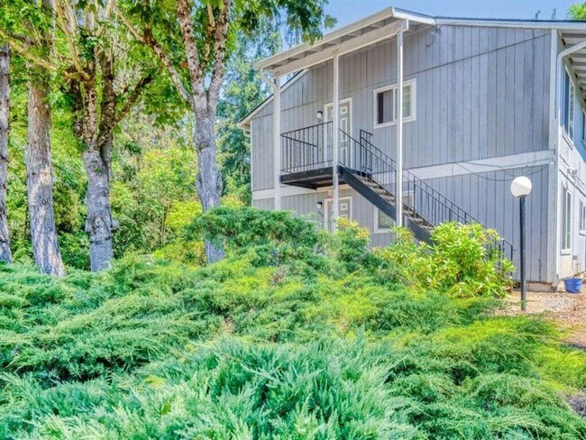 Building Photo - Ground-Level Apartment Available Now at Sunset Villa!