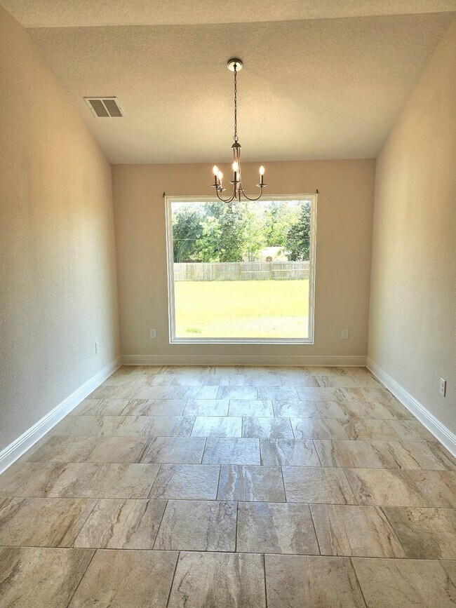 Building Photo - Welcome to this stunning 4-bedroom, 3-bath...