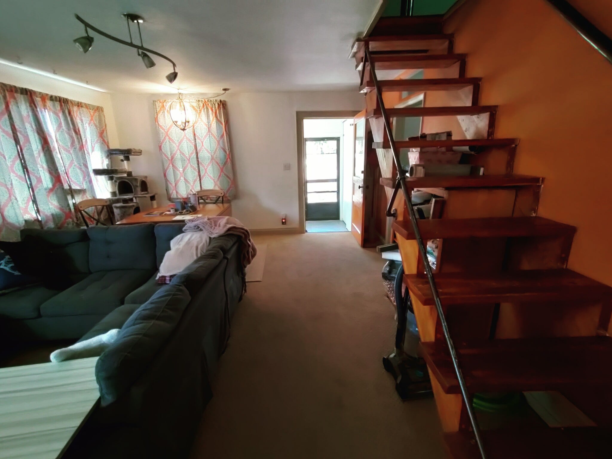 living room with stairs to loft - 1618 Person Ct