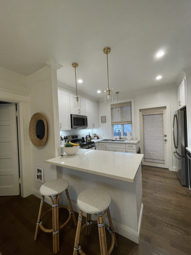Kitchen with bar seating - 2791 Greenwich St