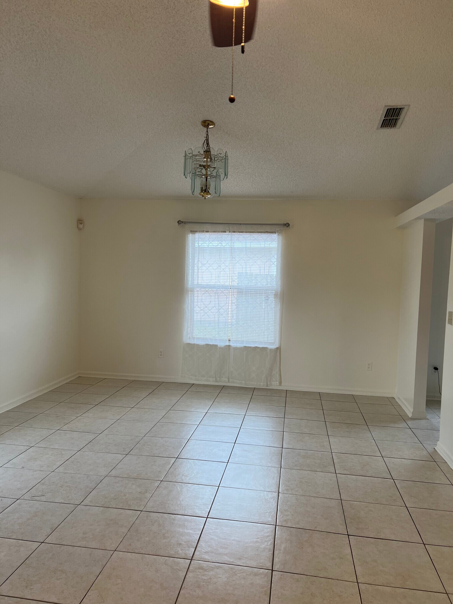 generously sized second bedroom with a walk-in closet and ceiling fan, providing both comfort and fu - 5374 Lacy Jane Way