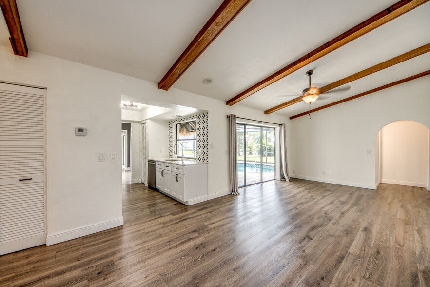 Kitchen access is between the great room and the family room and all of them overlook the pool. - 2316 Everest Pky