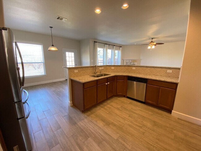 Building Photo - Step into this stunning 4 bedroom, 2.5 bathroom haven that radiates modern elegance and abundant ...