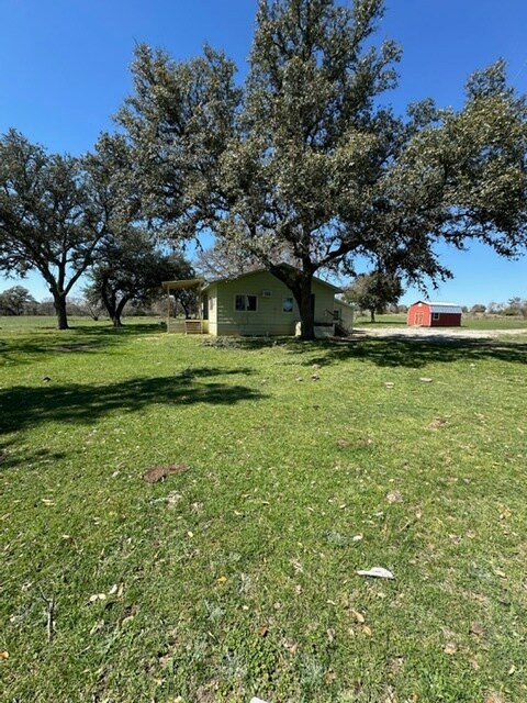 Side view. Barn is no longer there. - 9900 E State Highway 71