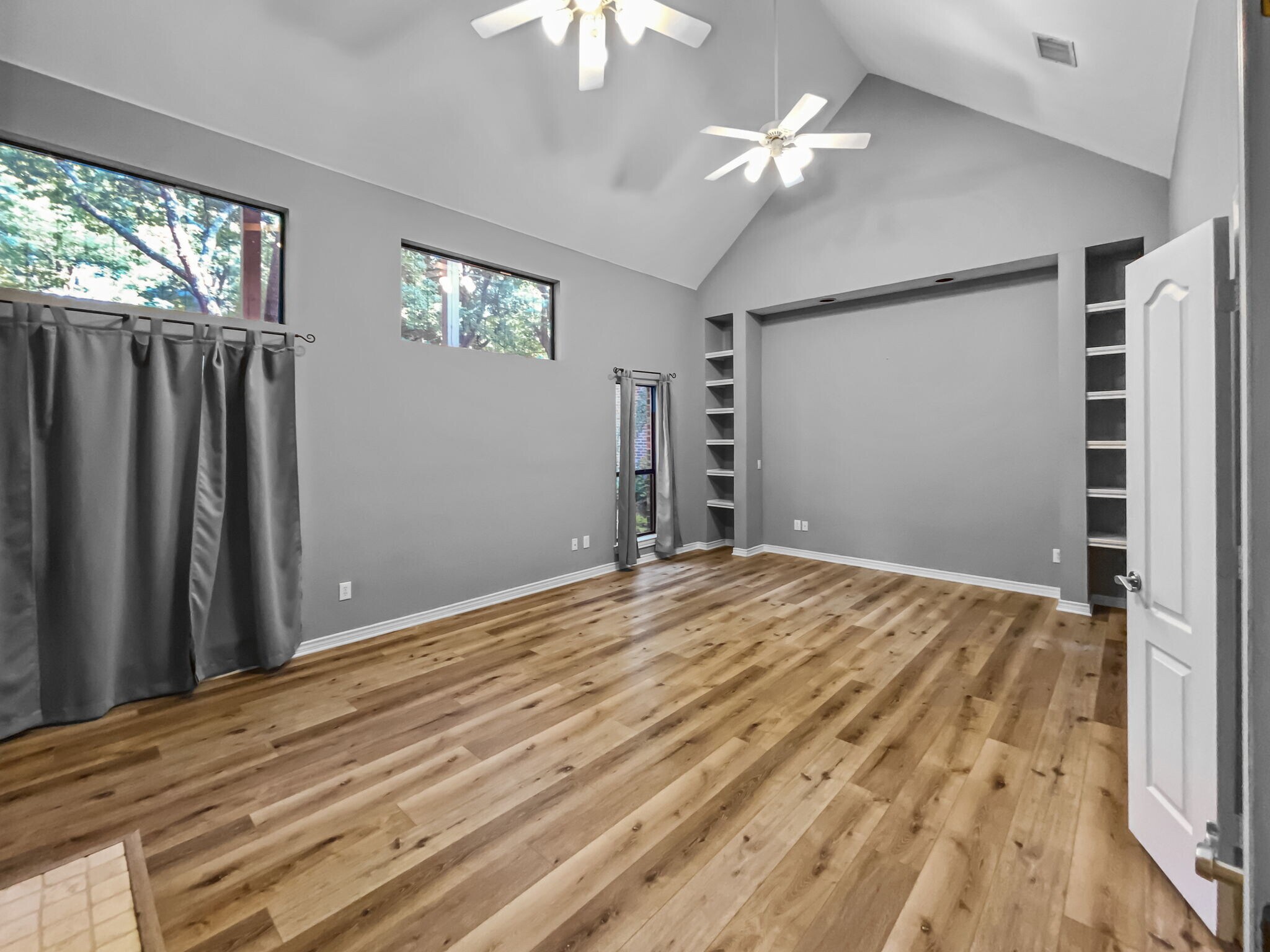 Primary bedroom with luxury vinyl plank flooring. - 1314 Creekwood Dr
