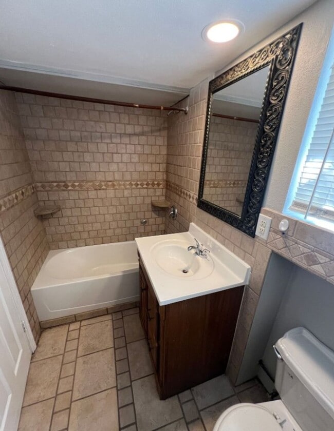 Building Photo - Spacious 4-Bedroom Home with Finished Base...