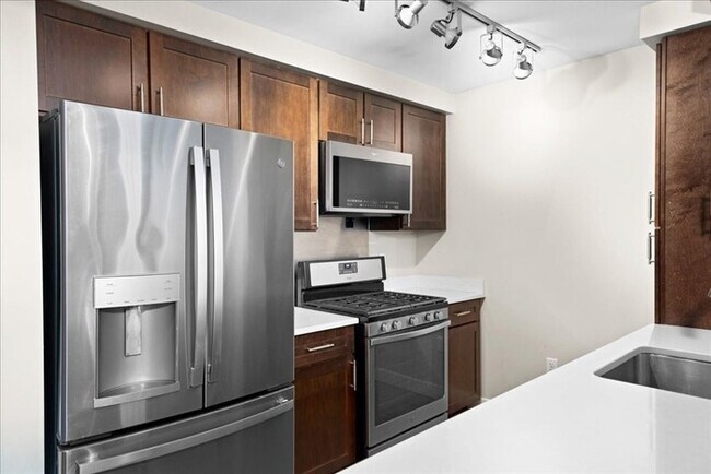 Building Photo - Stylish Industrial Loft with Exposed Brick, High Ceilings & Modern Kitchen