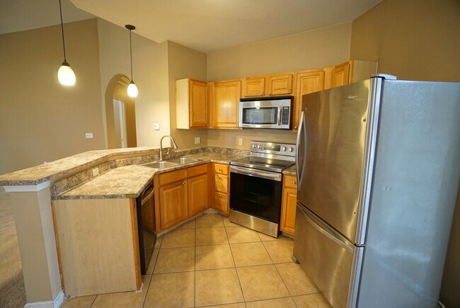 Building Photo - 2-Bed, 2-Bath, Condo with Garage in The Villas Condominiums