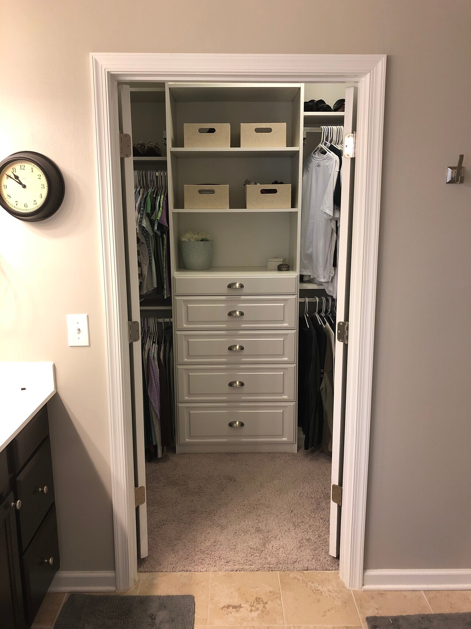 Custom cabinetry in the master closet maximizing the space. - 7736 Tranquil Trl
