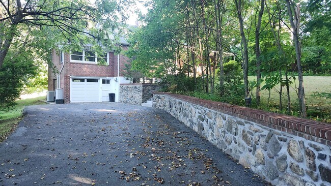 Building Photo - Elegant Multi-Level Brick Residence with Outdoor Oasis