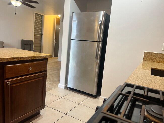 Building Photo - One bedroom semi-furnished bottom floor condo