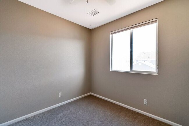 Building Photo - 3BR Townhome Near DIA & Light Rail | New Carpet, Garage & Fenced Patio