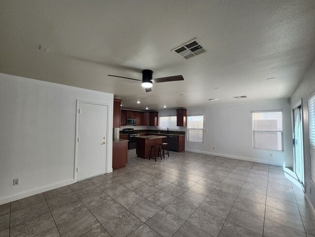Building Photo - Sleek 2 story home with tile in most living areas and upgraded kitchen.