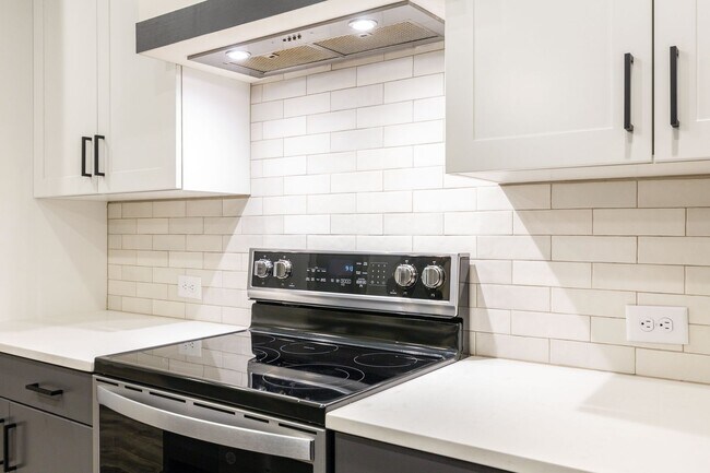 Building Photo - Modern Living Meets Walkable City Charm in...