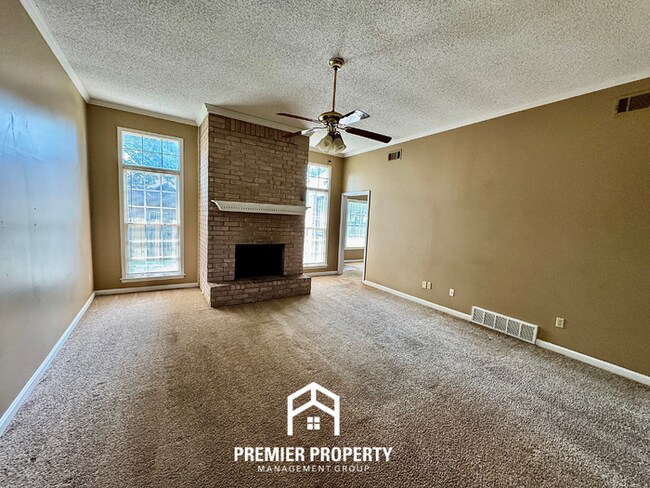 Building Photo - Spacious 3BR/2BA Near Southwind | 1,958 Sq Ft, Brick Fireplace, 2-Car Garage & Quiet Cove