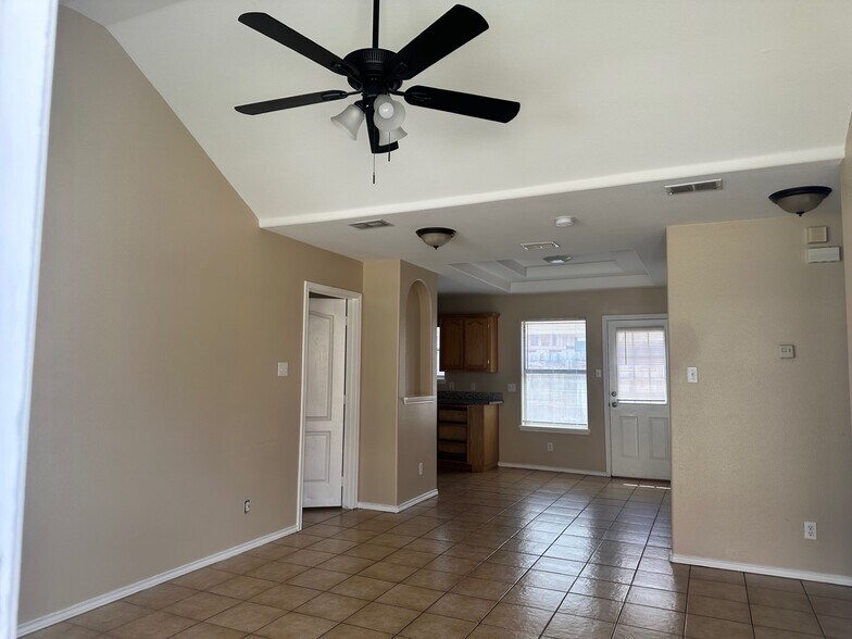living room with new ceiling fan - 2117 W Western Dr