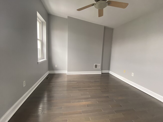 Upstairs master bedroom, hardwood floor, ceiling fan - 1618 Fitzwater St