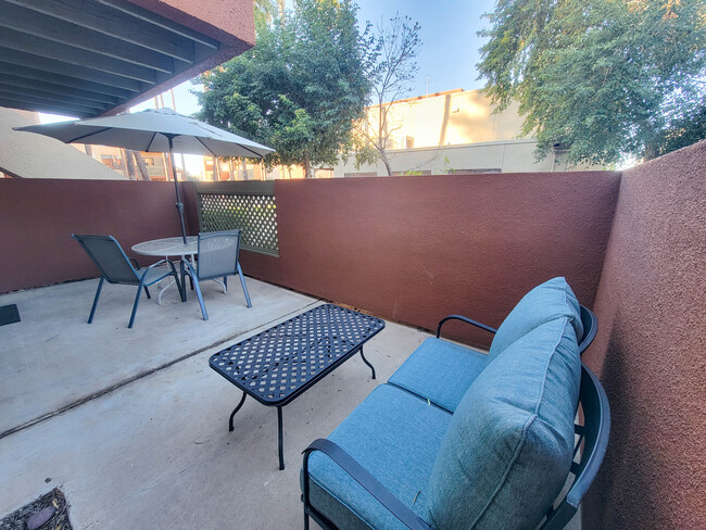 There is plenty of room on the patio, which includes a loveseat and 2 chairs, plus 2 tables and an u - 3500 N Hayden Rd