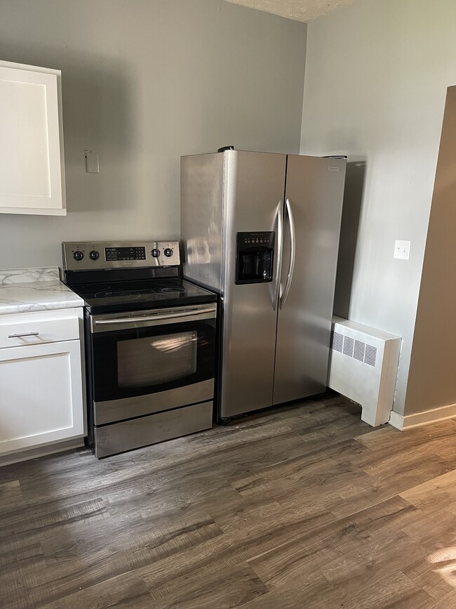 kitchen, new floor and ceiling fan - 319 N Pierce St