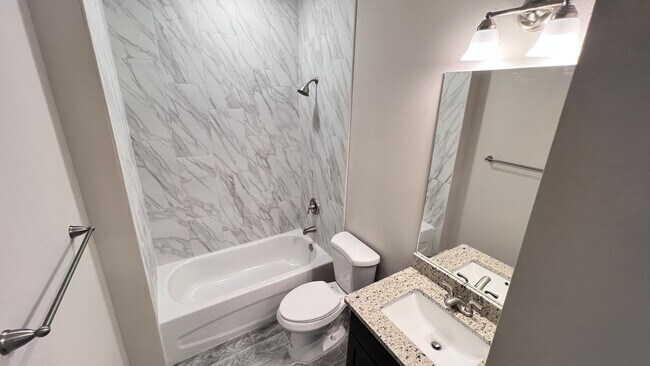 Building Photo - Spacious 3-Bedroom Home with Garage & Pati...