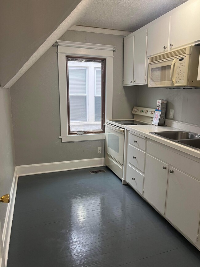 Kitchen. New cabinets, stove, microwave, fridge - 1159 Bush Ave