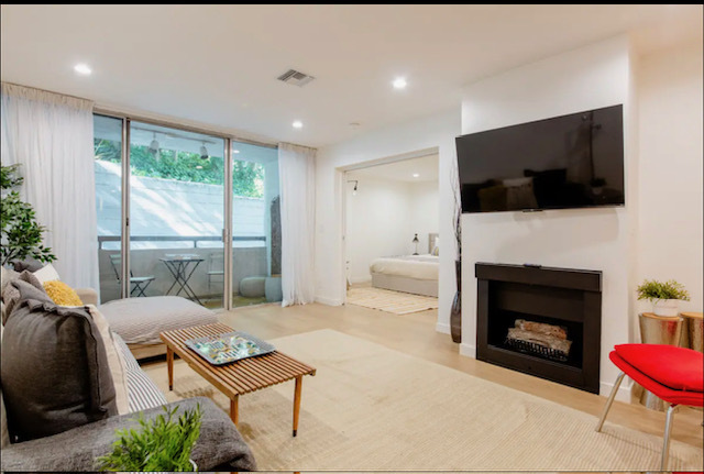 Living room facing patio - 8535 Knoll N W Dr