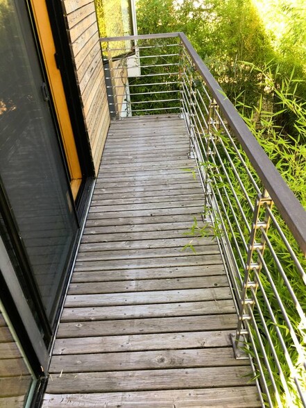 Balcony off living room overlooks yard and bamboo garden - 6606 Corson Avenue South