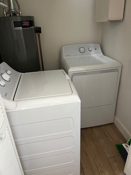 New washer dryer next to kitchen. - 2844 E Edison St