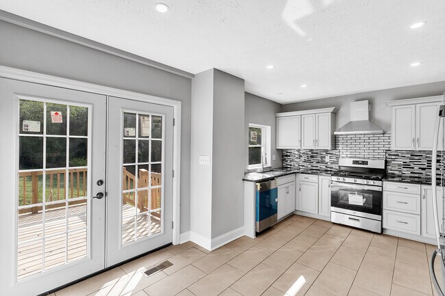Brand new kitchen with convenient access to the oversized back deck - 2416 Magee Road Ext