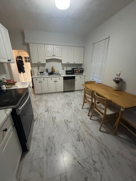Kitchen w/ new appliances + countertops - 44 Russell Rd