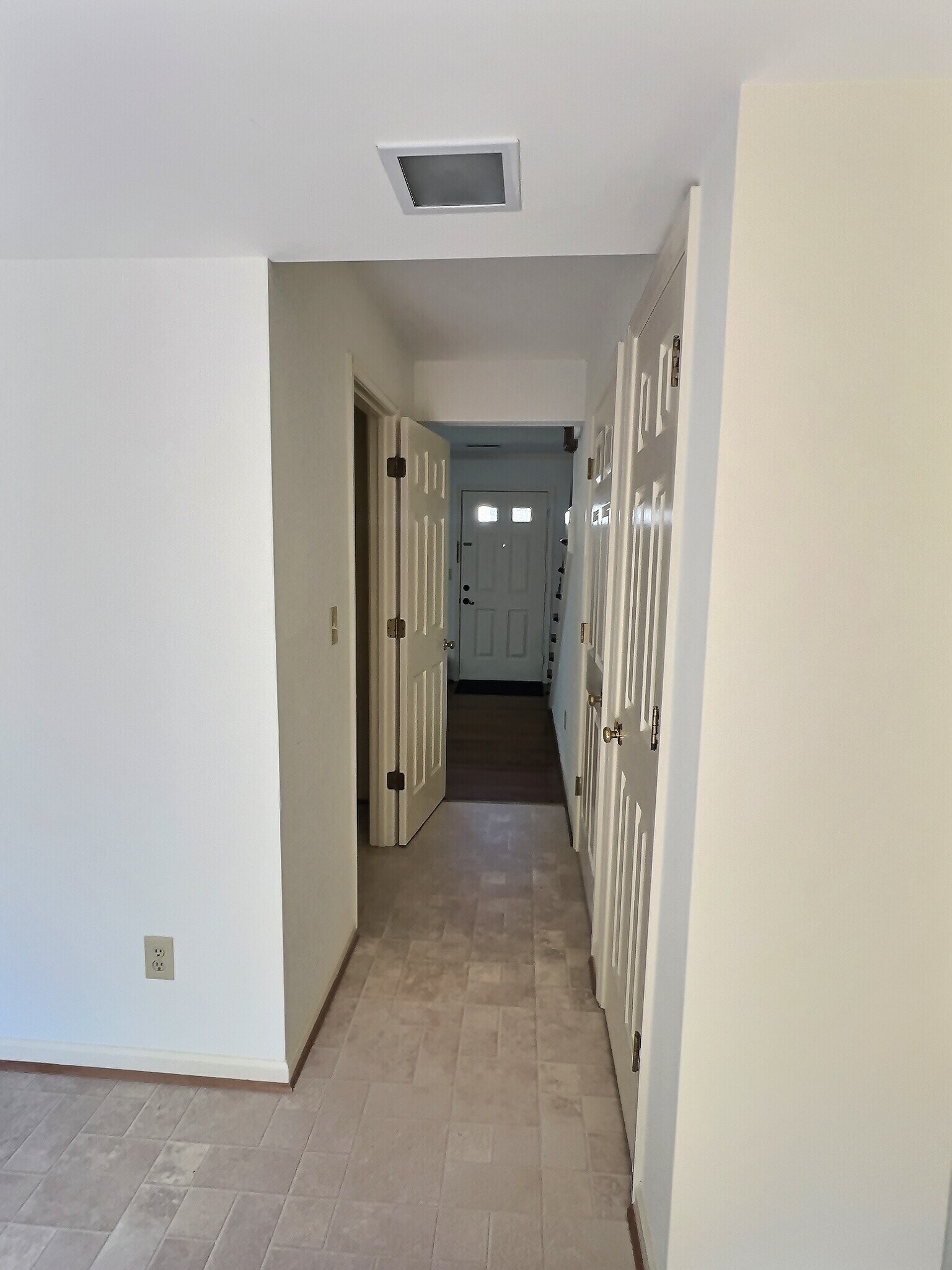 View of hallway, 1/2 bath entrance towards front door - 69 Court Pl