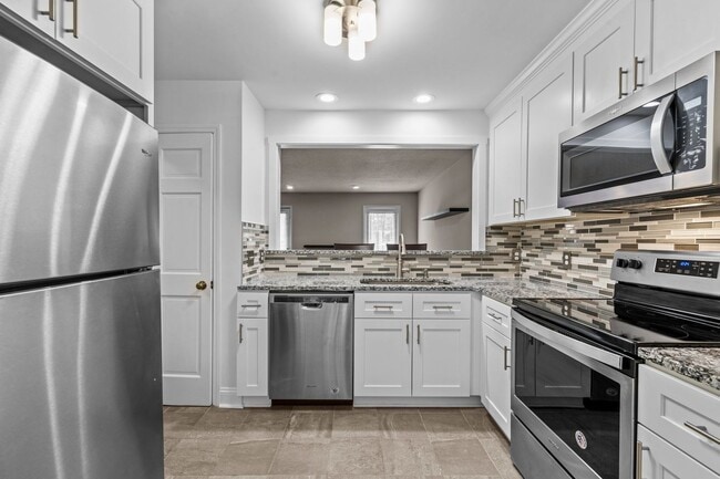 Building Photo - Updated and Adorable!  2 Bedroom Townhome in N/E Raleigh near REX, Glenwood, & Crabtree - Pet Fri...
