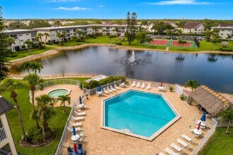 Building Photo - AVAILABLE NOW! Furnished Ground-Floor End Unit | Lake & Pool Views | Minutes to Marco Island & Do...