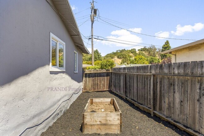 Building Photo - Central Novato Home with Large Yard and A/C!